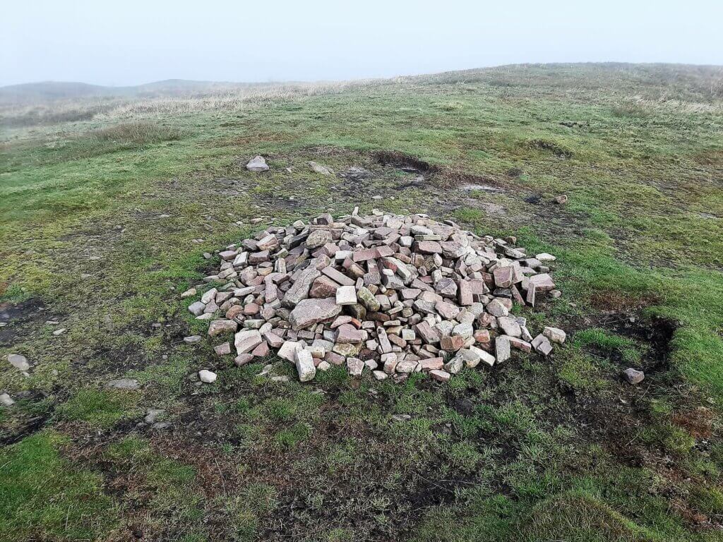 stone cairn at the summit of tor y foel