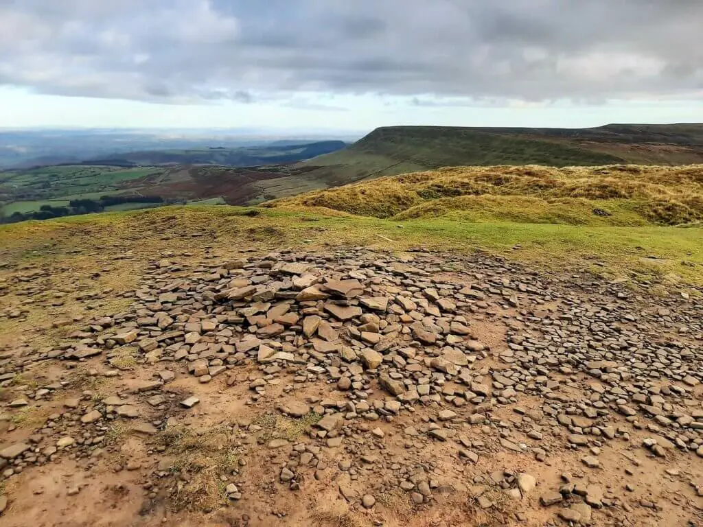 small stone cairn at the summit of twmpa