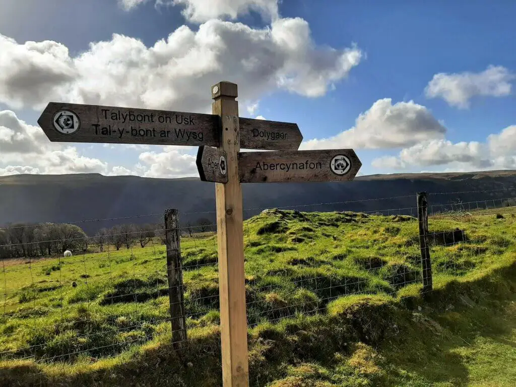 wooden sign at the top of the brecons way