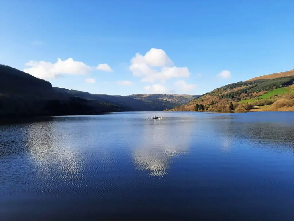view of talybont reservoir with clouds reflecting off the water