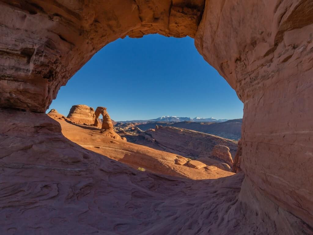 delicate arch viewed through twisted doughnut arch